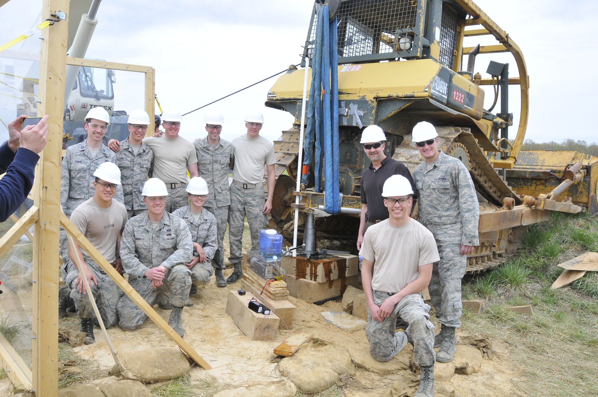 The Air Force Academy accepts the Service Academy Team Award at the third annual Air Force Research Laboratory Collegiate and Service Academy Engineering Design Competition. Team members shown on the front row, left to right are: Cadet 1st Class Jake Risma, Cadet 1st Class Jason Hodges, Cadet 1st Class Rebecca Bauman and Cadet 1st Class Max Jones; back row, left to right: Capt. Mike Knauf, Cadet 1st Class Kevin Tanous, Cadet 1st Class Mark Jensen, Cadet 1st Class Alex Pecci, Cadet 1st Class Will Fleming, Dr. Daniel Jensen and Cadet 2nd Class Kenner Roberts. (Photo by Jacqueline Cowan)