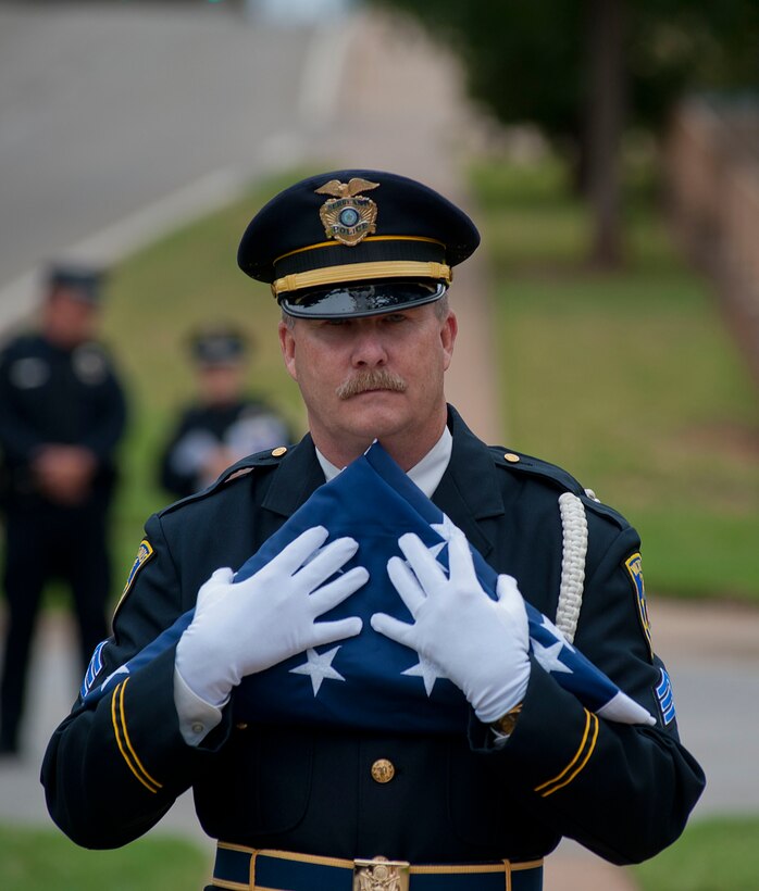 The 82nd Security Forces Squadron was present at a commemoration ceremony in downtown Wichita Falls May 12, 2014, along with local, state and municipal police to honor National Police Week. In 1962, President John F. Kennedy signed a proclamation designating May 15th as Peace Officers Memorial Day and the week in which that date falls as Police Week. (U.S. Air Force photos by Airman 1st Class Jelani Gibson)