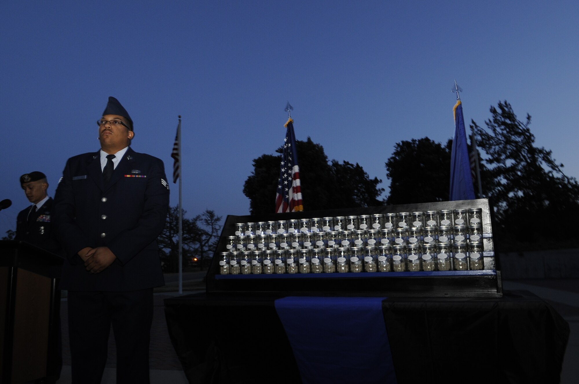 Senior Airman Devin Dotson, 30th Security Force Squadron commander’s support staff, prepares to light ceremonial candles during a vigil, May 15, Vandenberg Air Force Base, Calif. Although police week consists of numerous events aiming to celebrate those who paid the ultimate price, this particular observance is a source of immense pride for the 30th SFS. (U.S. Air Force photo by Senior Airman Shane Phipps/Released)
