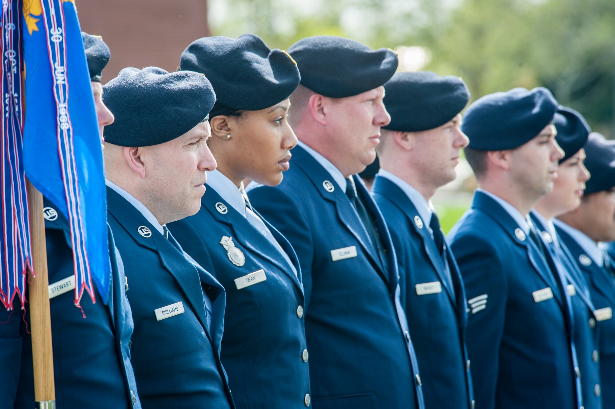 In honor of National Police Week, 92nd Security Forces Squadron defenders stand at attention during the singing of the national anthem as part of a special retreat ceremony at Fairchild Air Force Base, Wash., May 15, 2014. This national remembrance week occurs every year in recognition of the service and sacrifice of U.S. law enforcement officers who lost their lives ensuring America’s safety and protection. (U.S. Air Force photo by Staff Sgt. Benjamin W. Stratton/Released)