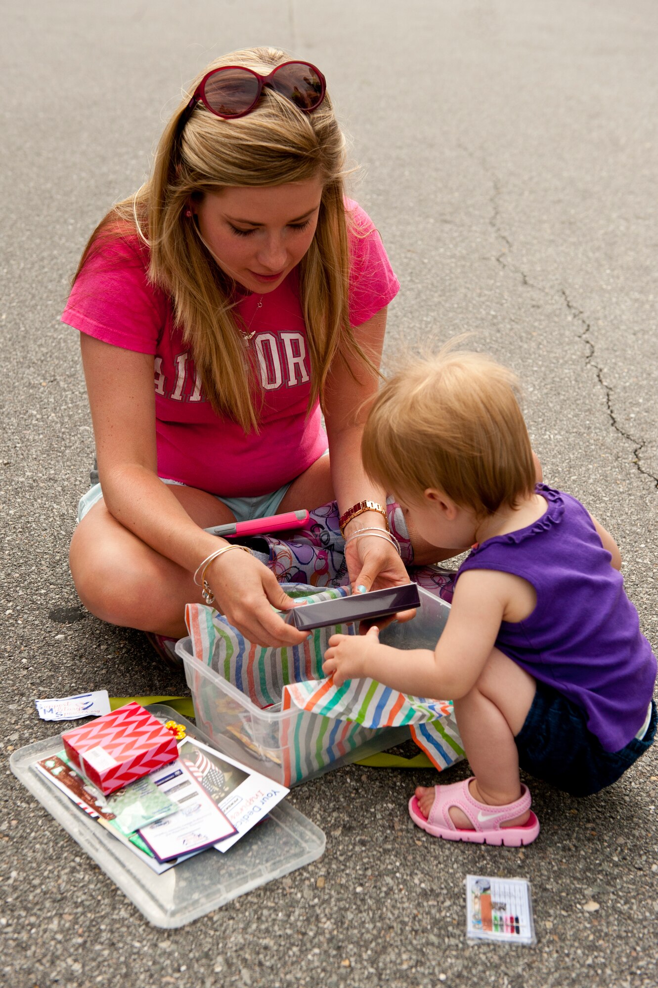 Family members of 2nd Lt. Joe Underwood, 333rd Fighter Squadron weapons system officer, open a gift during the Shoeboxes for Military Spouses event, May 16, 2014, in Goldsboro, North Carolina.  “It really means a lot to be recognized and feel appreciated for the things we do to help our spouses,” Underwood said.  Support Military Spouses is a private organization dedicated to supporting the wives and husbands of service members.  (U.S. Air Force photo/Airman 1st Class Brittain Crolley)