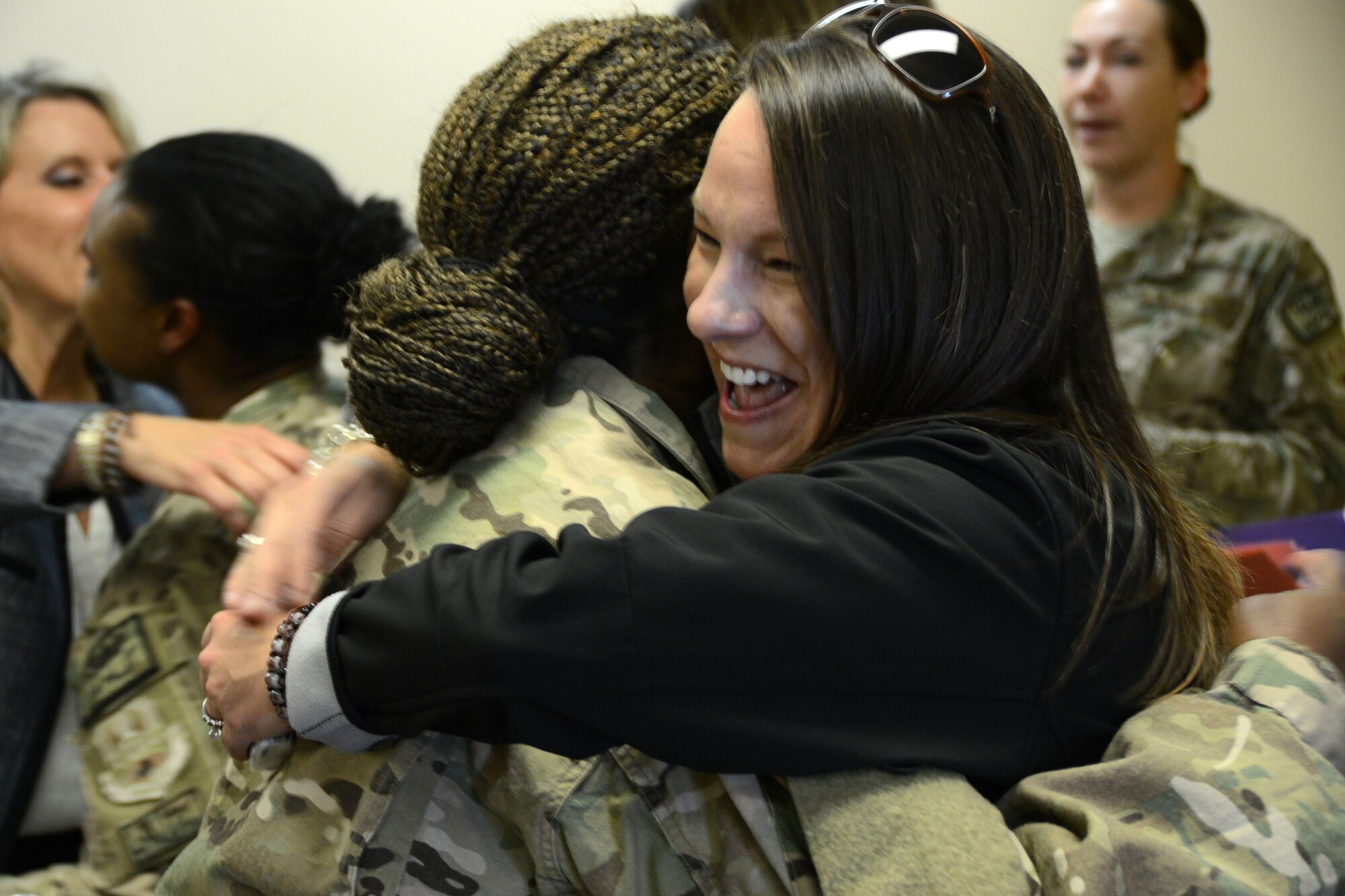 BAGRAM AIRFIELD, Afghanistan – Rep. Martha Roby (Ala.), House of Appropriations Committee, hugs U.S. Air Force Master Sgt. Cynthia Jackson, maintenance supply NCOIC after learning of Jackson’s birthday. Jackson joined several other deployed mothers from the 187th Fighter Wing, Montgomery, Ala. as they greeted a congressional delegation comprised of Roby; Rep. Susan Davis (Calif.), House of Armed Services Committee; Rep. Niki Tsongas (Mass.), House of Armed Services Committee; Rep. Renee Ellmers (N.C.), Energy & Commerce Committee; Rep. Cheri Bustos (Ill.), Agriculture; Transportation & Infrastructure; Ms. Debra Wada, professional staff member; Ms. Jaime Cheshire, senior advisor to the chairman and Maj. Janine Garner, U. S. Marine Corps service escort during their visit to Afghanistan May 12, 2014. Roby, a native of Alabama is a member of an annual Mother’s Day congressional delegation that visits Afghanistan to check the well-being and quality of life of American and Afghan women serving in the military. (U.S. Air Force photo by Master Sgt. Cohen A. Young)