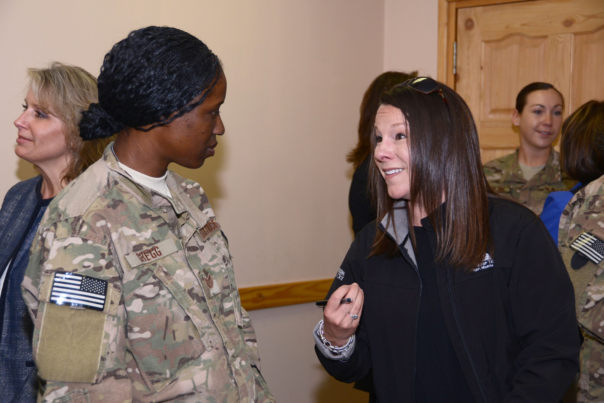 BAGRAM AIRFIELD, Afghanistan – U.S. Air Force Tech Sgt. Calnecia Gregg, a native of Montgomery, Ala., and currently assigned to the 455th Expeditionary Aircraft Maintenance Squadron speaks with Rep. Martha Roby (Ala.), House of Appropriations Committee during an annual Mother’s Day congressional delegation with the 187th Expeditionary Fighter Squadron May 12, 2014. The delegation visits Afghanistan to check on the well-being and quality of life of American and Afghan women serving in the military. (U.S. Air Force photo by Master Sgt. Cohen A. Young)