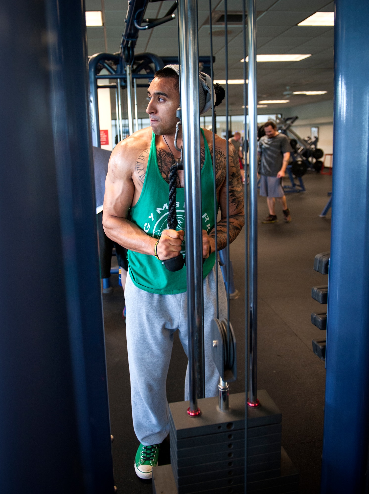 U.S. Air Force Staff Sgt. Israel Garza, 23d Security Forces Squadron unit trainer, performs tricep extensions at Moody Air Force Base, Ga., March 7, 2014. After overcoming a back injury in which doctors told him he would never be able to squat or deadlift again, Garza took up powerlifting and achieved a personal record of 550 pounds for deadlifts and 600 pounds on squats.  (U.S. Air Force photo by Senior Airman Jarrod Grammel/Released)
