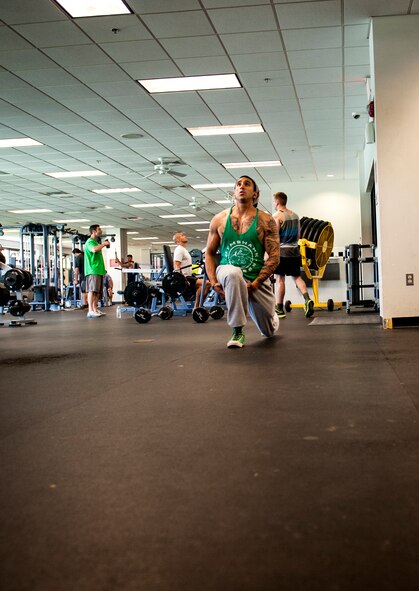 U.S. Air Force Staff Sgt. Israel Garza, 23d Security Forces Squadron unit trainer, performs lunges at Moody Air Force Base, Ga., March 7, 2014. Garza is currently training for his first bodybuilding competition scheduled for June. (U.S. Air Force photo by Senior Airman Jarrod Grammel/Released)
