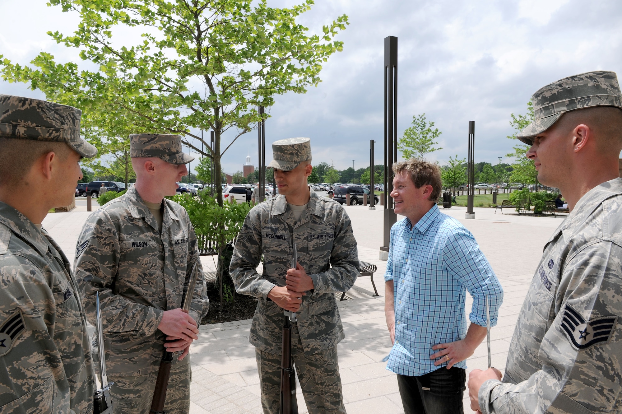 Boxer, a WMZQ radio station DJ, speaks with members of the United States Air Force Drill Team after a performance during the stations Military Appreciation Week event at Joint Base Andrews, Md., May 15, 2014. (U.S. Air Force photo/Airman 1st Class Ryan J. Sonnier)