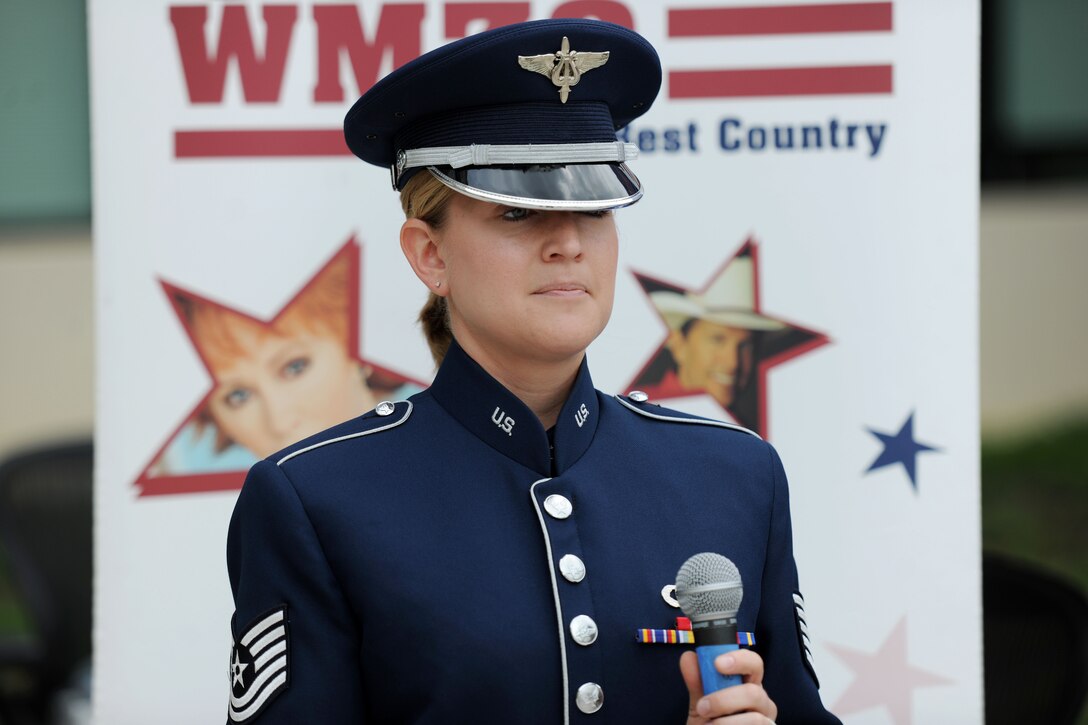 Tech. Sgt. Mandi Harper prepares to sing the National Anthem at Joint Base Andrews, Md., May 15, 2014. Harper, United States Air Force Band soprano vocalist, sang the National Anthem as part of radio station WMZQ’s Military Appreciation Week. (U.S. Air Force photo/Airman 1st Class Ryan J. Sonnier)