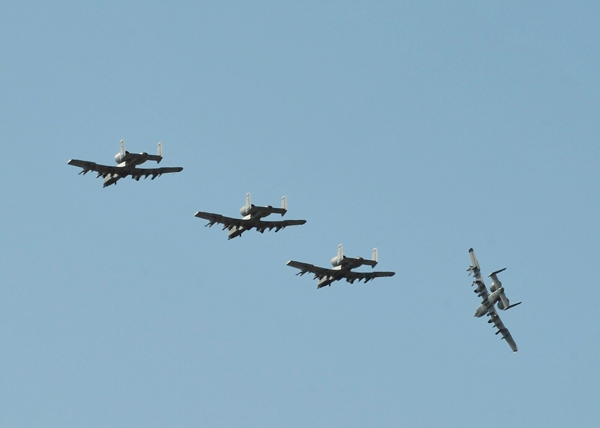 Four A-10 Thunderbolts assigned to the 354th Fighter Squadron, Davis-Monthan Air Force Base, Ariz., fly in formation before landing during RED FLAG-Alaska 14-1 May 14, 2014, Eielson Air Force Base, Alaska. The 354th FS sent maintainers and pilots, as well as eight A-10 aircraft to Eielson to participate in RF-A through May 23. (U.S. Air Force photo by Senior Airman Ashley Nicole Taylor/Released)