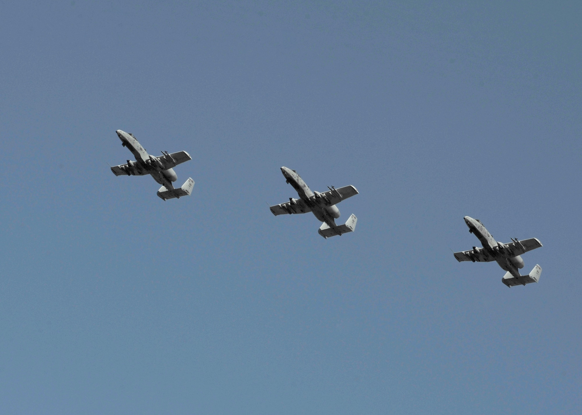 Three A-10 Thunderbolts assigned to the 354th Fighter Squadron, Davis-Monthan Air Force Base, Ariz., fly in formation during RED FLAG-Alaska 14-1 May 14, 2014, Eielson Air Force Base, Alaska. A-10s are simple, effective and survivable twin-engine jet aircraft that can be used against all ground targets, including tanks and other armored vehicles. (U.S. Air Force photo by Senior Airman Ashley Nicole Taylor/Released)