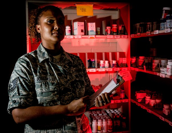 Tech. Sgt. Rikkieta Jones, 628th Medical Group pharmacy technician, performs a daily count of medicine in the pharmacy vault to make sure all medication is accounted for May 15, 02014, at Joint Base Charleston, S.C. The pharmacy technicians fill prescriptions for active duty, reservists, retirees and dependents of military members. (U.S. Air Force photo/ Senior Airman Dennis Sloan)