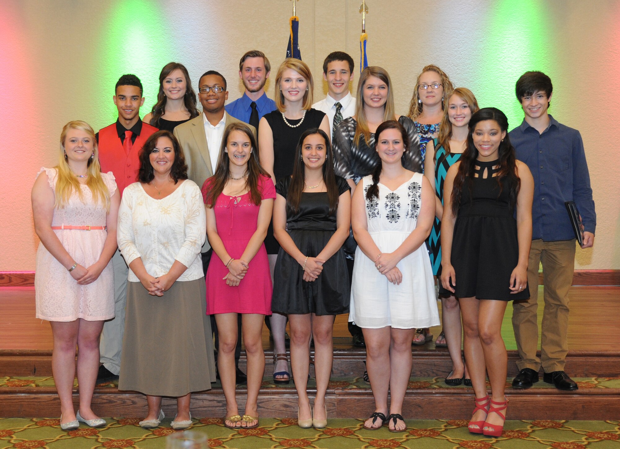 Dependents of Keesler members pose for a photo during a ceremony where they were each awarded scholarships on behalf of the Keesler Spouses Club May 13, 2014, at the Bay Breeze Event Center, Keesler Air Force Base, Miss. The KSC gave out 17 scholarships that totaled approximately $23,000. For more information about the scholarships or the Keesler Spouses Club call (228) 377-3217. (U.S. Air Force photo by Kemberly Groue)