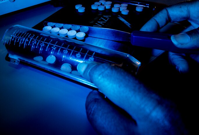 Tech. Sgt. Rikkieta Jones, 628th Medical Group pharmacy technician, counts pills to fill a prescription May 15, 2014, at Joint Base Charleston, S.C. The pharmacy technicians fill prescriptions for active duty, reservists, retirees and dependents of military members. (U.S. Air Force photo/ Senior Airman Dennis Sloan)