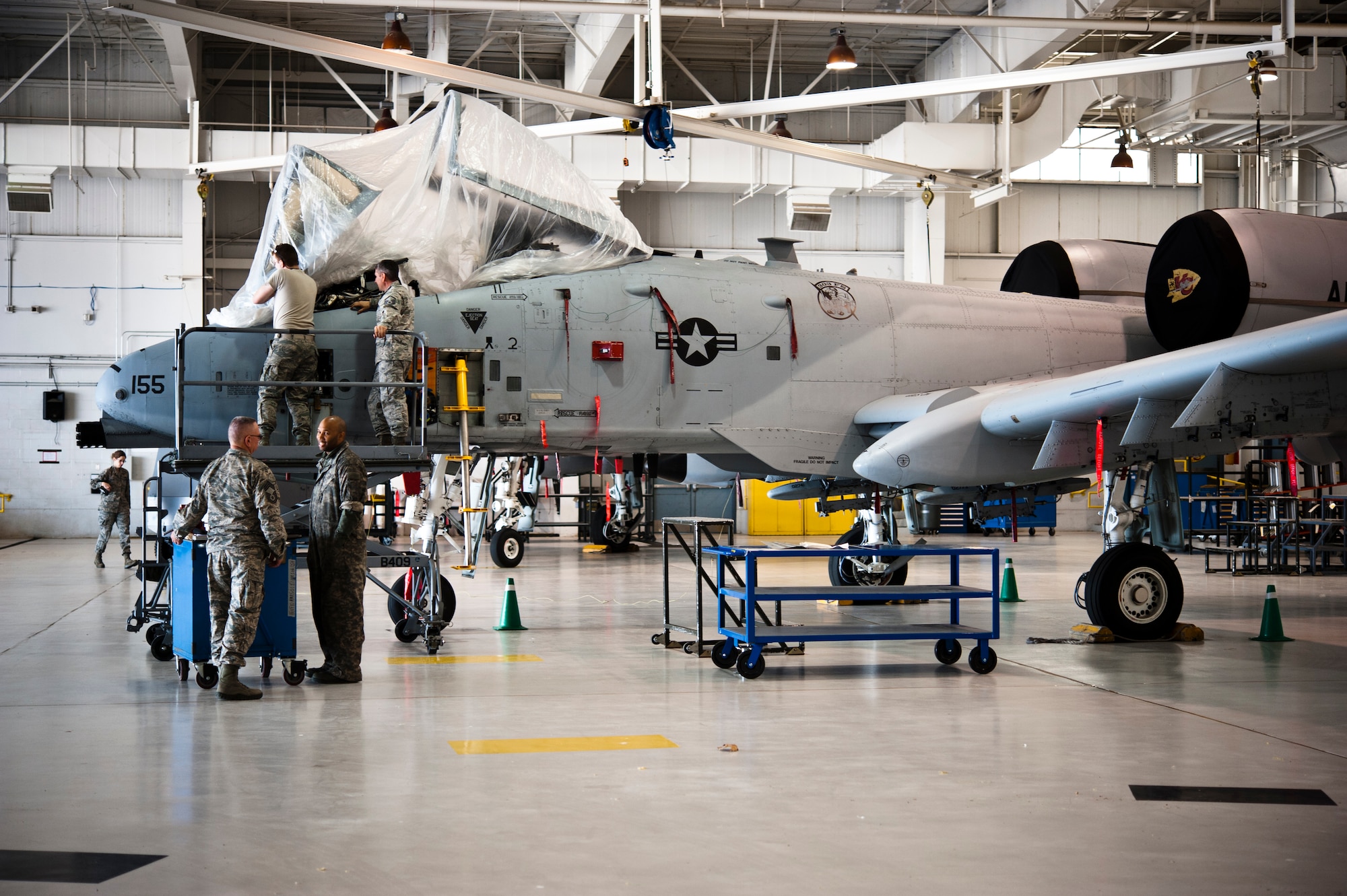 Airmen from the 442nd Aircraft Maintenance Squadron go over tasking orders for an A-10 Thunderbolt II May 15, 2014 at Whiteman Air Force Base, Missouri. The A-10 Thunderbolt II is the first Air Force aircraft specially designed for close air support of ground forces. (U.S. Air Force photo by Senior Airman Daniel Phelps/Released)