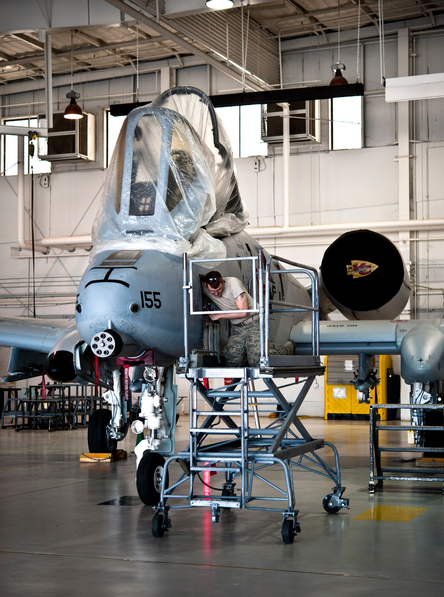 Senior Airman Daniel Hensley, 442nd Aircraft Maintenance Squadron electro-environmental technician from Sedalia, Missouri, performs maintenance work on an A-10 Thunderbolt II, May 15, 2014 at Whiteman Air Force Base, Missouri. Electro-environment technicians are responsible for performing and supervising aircraft electrical and environmental functions and activities. (U.S. Air Force photo by Senior Airman Daniel Phelps/Released)