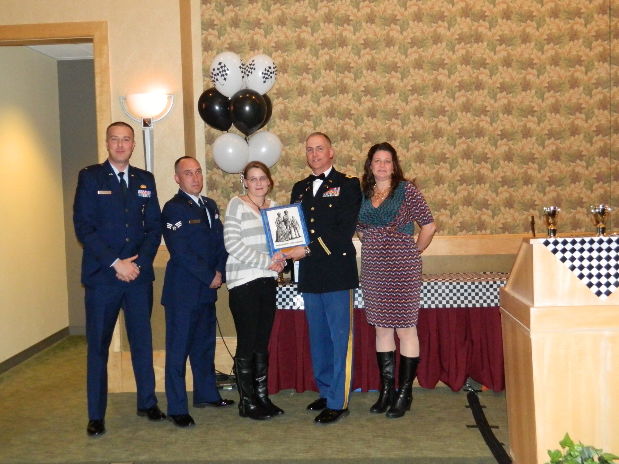 Kimberly healy receives the 2014 Massachusetts Air  National Guard’s Outstanding Family Readiness and Support Award.