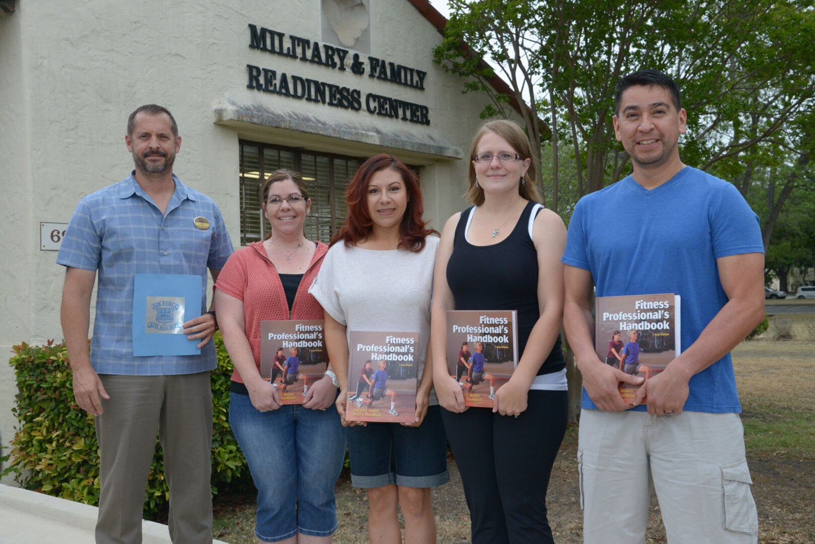 From left: Mike Bell, Joint Base San Antonio-Randolph Military & Family Readiness Center Air Force Aid officer, stands with Air Force Aid Society scholarship winners April Johnson, Candice Hollingsworth, Amanda Asselin and Pedro Gonzales, who received scholarships to become certified personal trainers May 6 at JBSA-Randolph. The Air Force Aid Society is the official charity of the U.S. Air Force. It promotes the Air Force mission by helping to relieve distress of Air Force members and their families and assist them to finance their education.
(U.S. Air Force photo by Joel Martinez)

