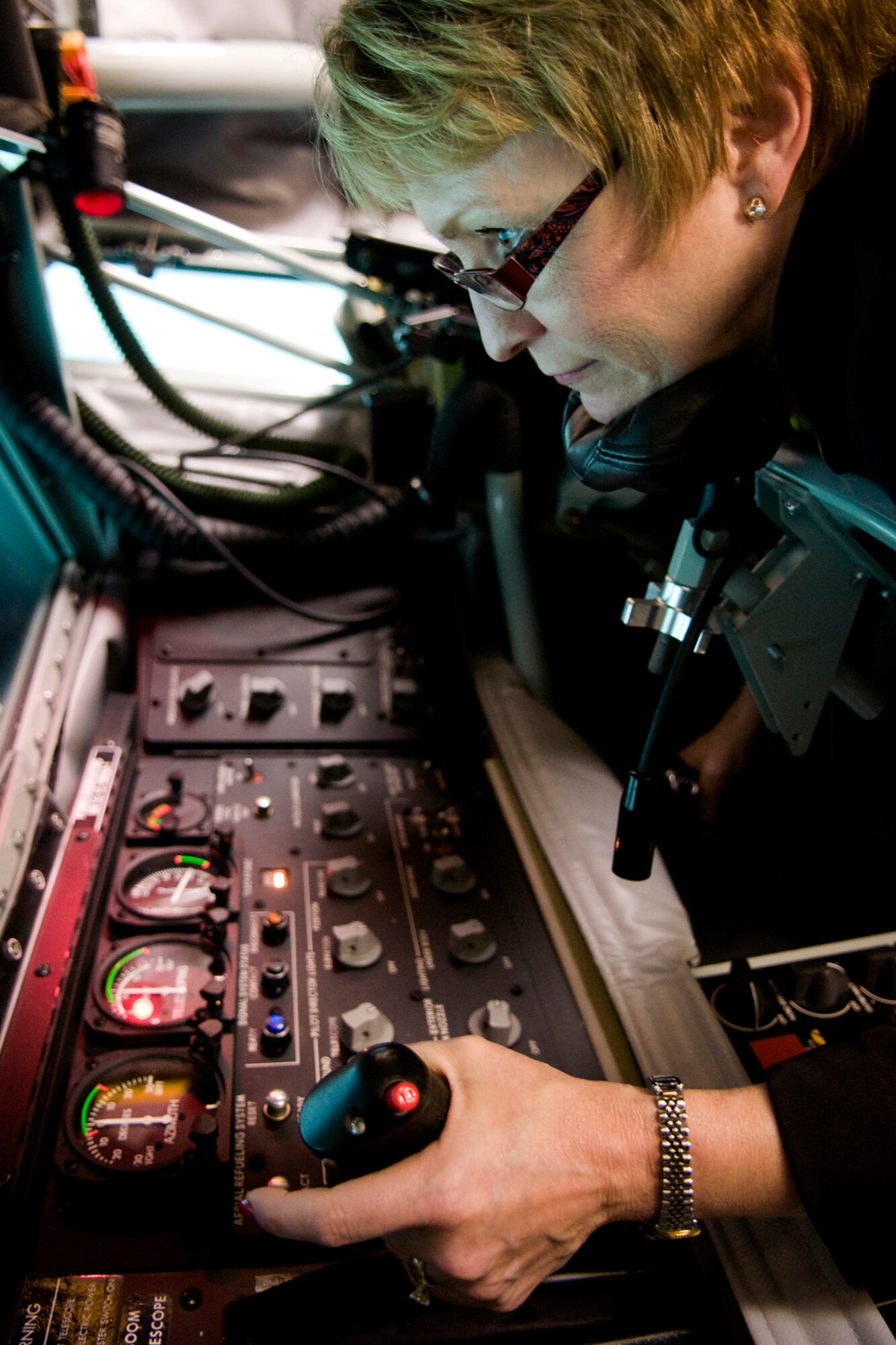 Indiana Lt. Gov. Sue Ellspermann refuels a simulated F-22 Raptor aircraft in a boom operator weapons system trainer at Grissom Air Reserve Base, Ind., May 14, 2014. Grissom's BOWST, which cost approximately $3 million, provides $3 million in savings per year as well as significant benefits by reducing the required number of flight hours in a KC-135 Stratotanker for boom operators to maintain training and currency. (U.S. Air Force photo/Tech. Sgt. Mark R. W. Orders-Woempner)