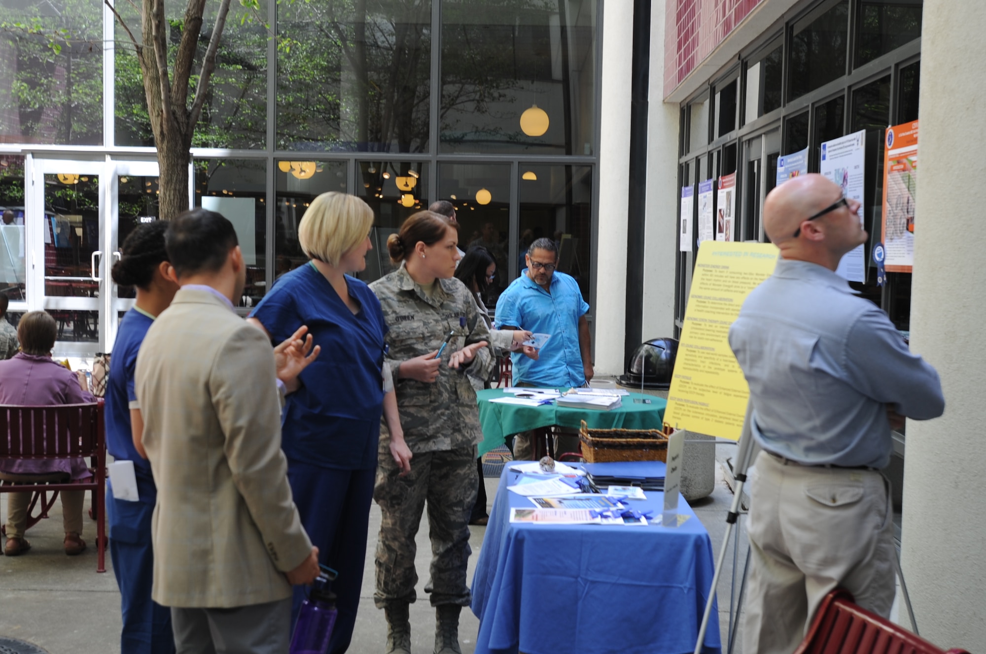 Medical staff and potential patient participants discuss ongoing and past research projects conducted by David Grant USAF Medical Center to advance the field of medicine May 9 at the annual research symposium hosted by the 60th Medical Group. (courtesy photo)
