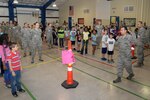 Air Force Master Sgt. Joe Ugarte, 802nd Force Support Squadron, briefs Randolph Elementary School third-graders on a military deployment process during Operation FLAGS May 8 at Joint Base San Antonio-Randolph. (U.S. Air Force photo by Johnny Saldivar)
