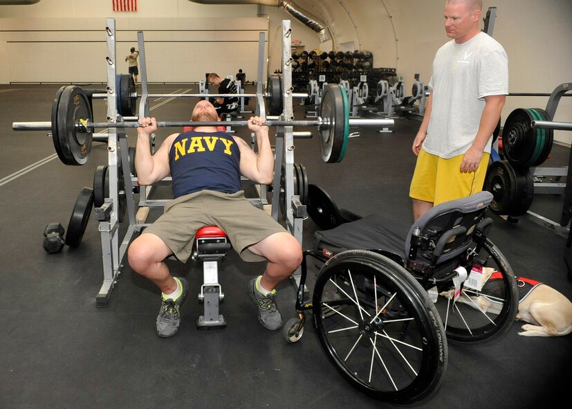 Steve Hancock, prior Navy, bench presses May 8 on base. Hancock competed in the shot put and discus events at the  weekend challenge. (U.S. Air Force photo/Senior Airman Marcy Copeland)