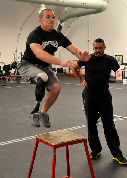 Army Sgt. Ryan McIntosh jumps onto a platform while training in the Warrior Fitness Center at Luke. McIntosh represents the Army in the World Athlete Program and trained at Luke before participating in the event. (U.S. Air Force photo/Senior Airman Marcy Copeland)