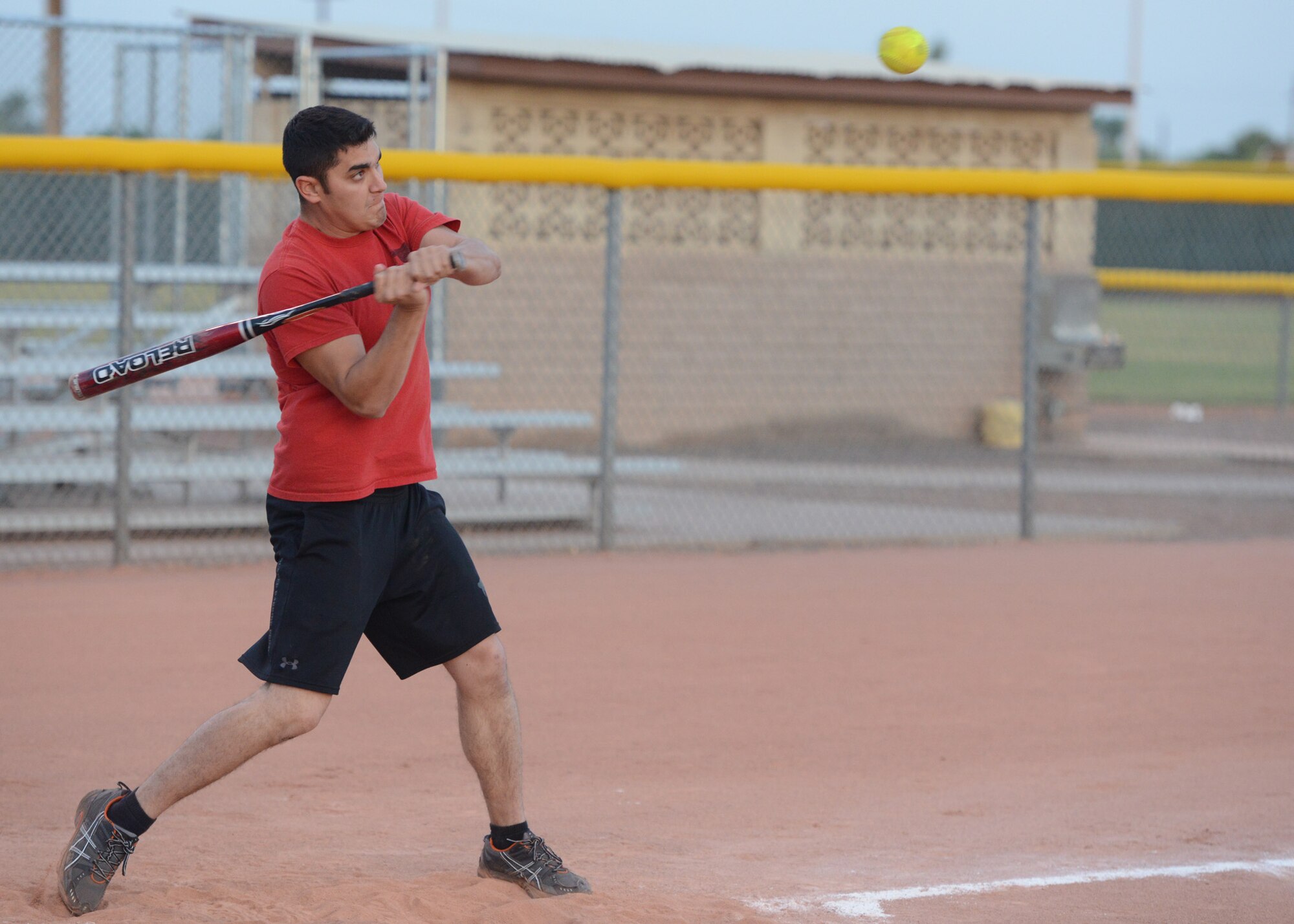 Christopher Gilbert, 56th Civil Engineer Squadron, takes a swing at the ball during an intramural softball game against 56th Communication Squadron May 6 at Luke Air Force Base. COMM defeated the 56th Fighter Wing Staff Agencies team 15-1. (U.S. Air Force photo/Senior Airman Devante Williams)