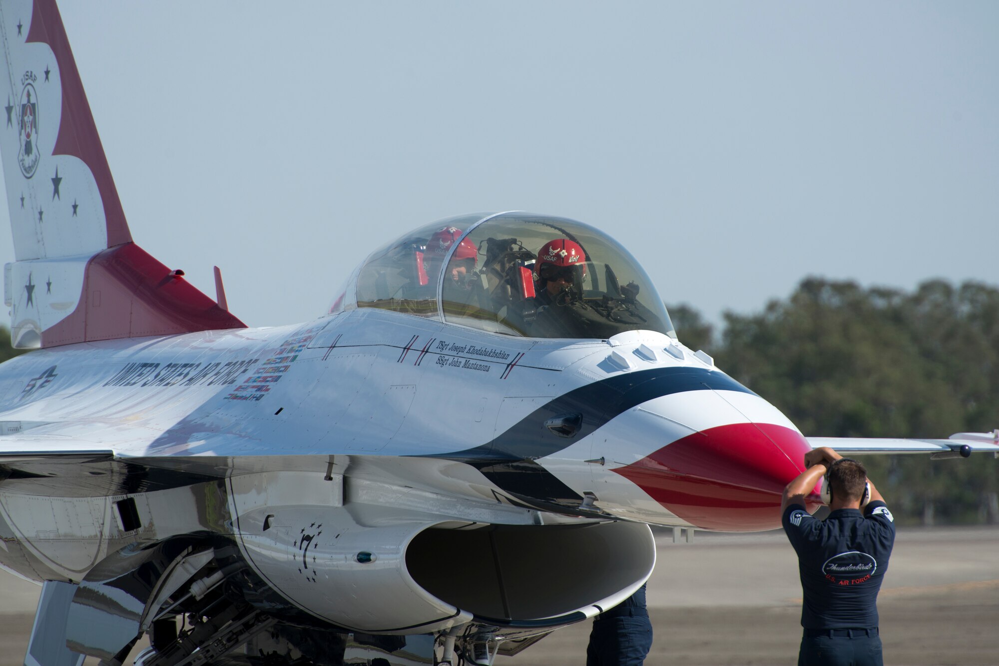 Maj. Tyler Ellison, a U.S. Air Force Thunderbirds pilot, taxis an F-16 Fighting Falcon to its parking spot after flying a “Hometown Hero” flight May 1 at Travis Air Force Base, Calif. Jackson Harris, a Solano County sheriff’s deputy, served as the installation’s hometown hero for the 2014 Travis Air Expo. (U.S. Air Force photo by Heide Couch)