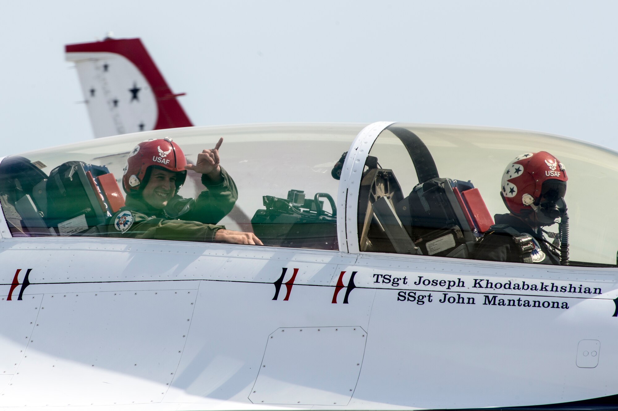 Jackson Harris, a Solano County sheriff’s deputy, sits in the back seat of an F-16 Fighting Falcon May 1, at Travis Air Force Base, Calif. Harris served as the installation’s “Hometown Hero” for the 2014 Travis Air Expo. (U.S. Air Force photo by Heide Couch)