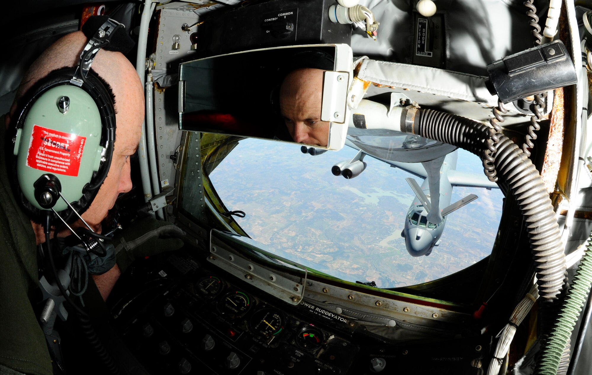 Senior Master Sgt. Ray Lewis, a refueling boom operator assigned to the 931st Air Refueling Group, McConnell Air Force Base, Kan., flies the boom of a KC-135 Stratotanker into the refueling receptacle of a B-52 Stratofortress from the 307th Bomb Wing, Barksdale Air Force Base, La., during a refueling exercise in the skies over Texas, May 15, 2014. Lewis has been serving as a boom operator for more than 24 years and recently passed 6,500 total flight hours. (U.S. Air Force Photo by Airman 1st Class Victor J. Caputo)
