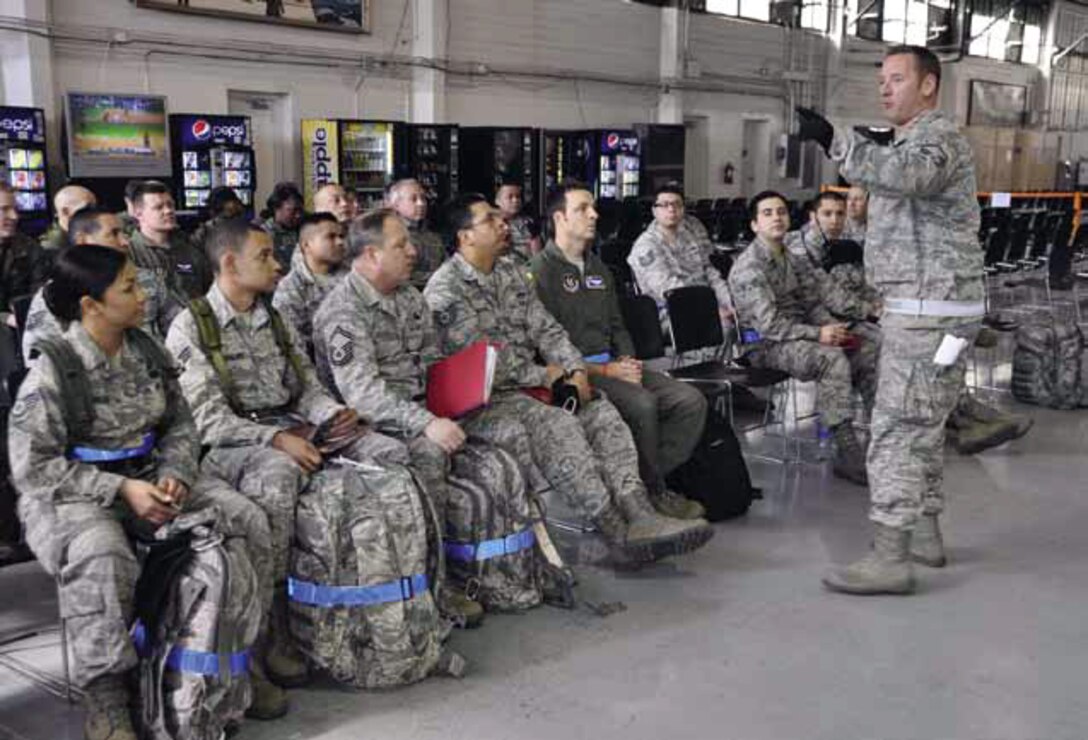 Airmen in the 452nd Air Mobility Wing, March Air Reserve Base, California, listen to instructions before moving through a mobility processing line during an operational readiness inspection. The 452nd AMW earned the 2013 Air Force Association Outstanding Reserve Flying Wing Unit Award, according to an announcement from the Air Force Reserve Command Headquarters May 9, 2014. (U.S. Air Force photo/Master Sgt. Linda Welz)