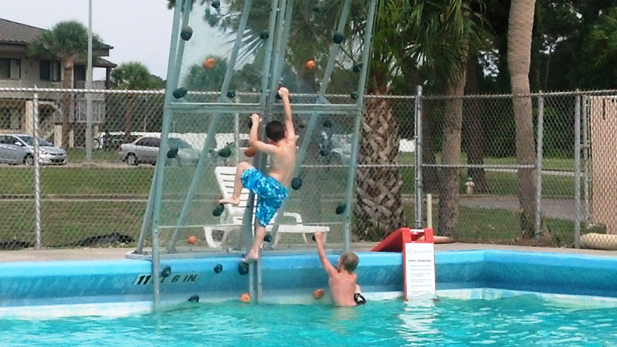 Members of Team Tyndall enjoy the base pool rock climbing wall in the summer of 2013.  (U.S. Air Force courtesy photo)