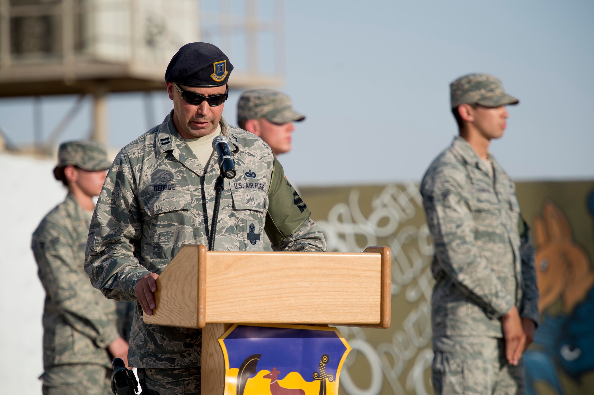 Capt. Christopher George, 386th Expeditionary Security Forces Squadron Raptor Flight commander, speaks to participants during a formal retreat ceremony on May 15, 2014 at an undisclosed location in Southwest Asia. Members came to pay their respects for a national Police Officer Memorial Day dedicated to all civilian and law enforcement members who have given their lives in the line of duty. (U.S. Air Force photo by Staff Sgt. Jeremy Bowcock)