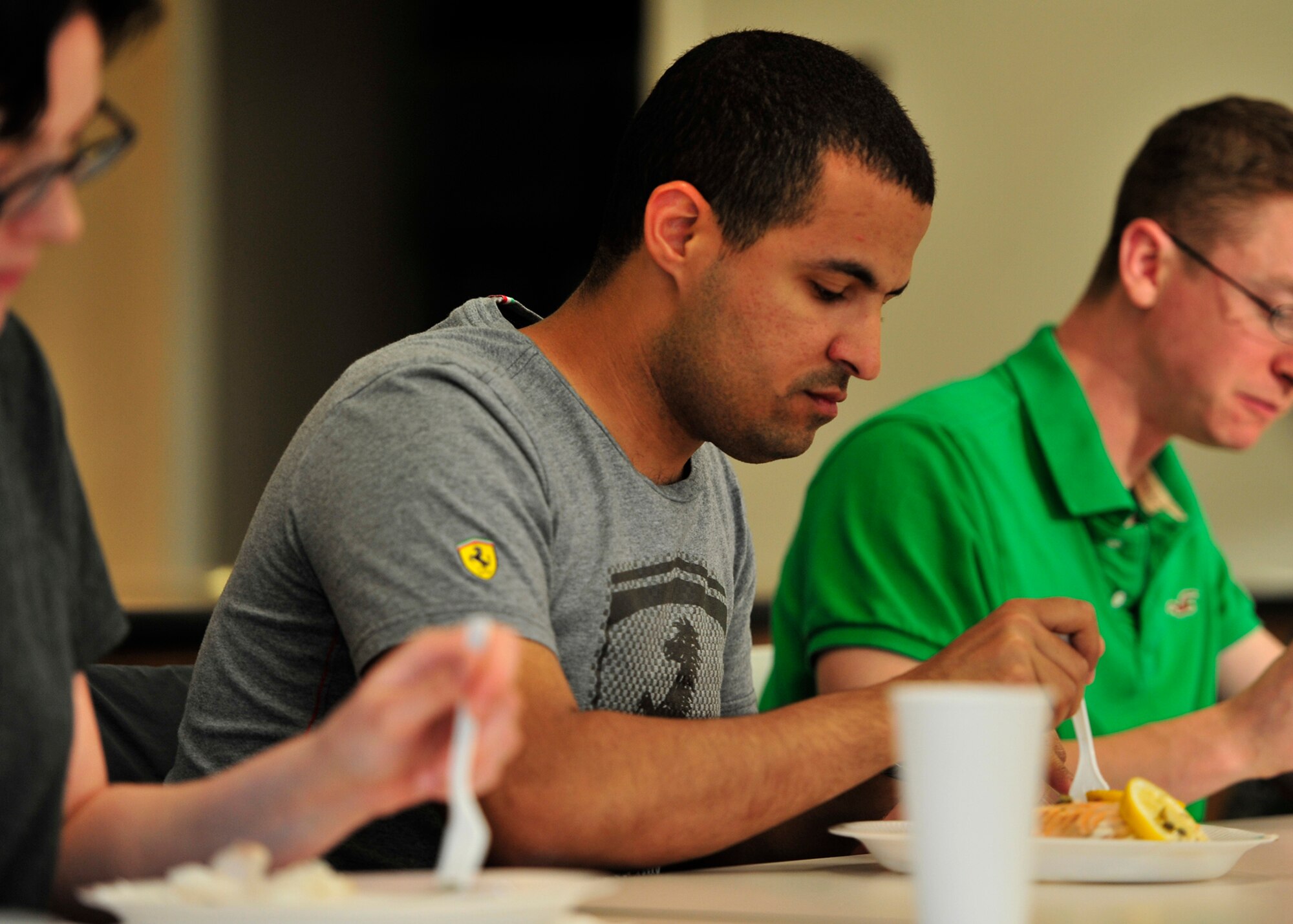 Airman 1st Class Alan Mejia, 436th Aerospace Medicine Squadron public health technician, enjoys the meal prepared in a Dorm to Gourm cooking class May 13, 2014 at Dover Air Force Base, Del. The Airmen that prepare the meals get to eat them when they are finished. (U.S. Air Force photo/Staff Sgt. Elizabeth Morris)  