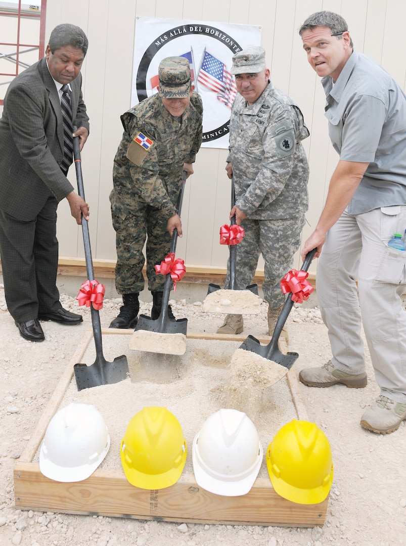 From left) Pedro Pena, Baharona Province governor; Maj. Gen.
Pedro A. Caceres, Dominican Republic vice minister of defense;
Brig. Gen. Orlando Salinas, U.S. Army South deputy commander
and Dan Foote, deputy chief of mission of the U.S. Embassy in the
Dominican Republic, take part in a ground-breaking ceremony May
6 at a construction site during Beyond the Horizon-Dominican
Republic 2014. BTH 2014 is an exercise deploying U.S. military
engineers and medical professionals to Guatemala and the Dominican
Republic for training, while providing services to rural communities.