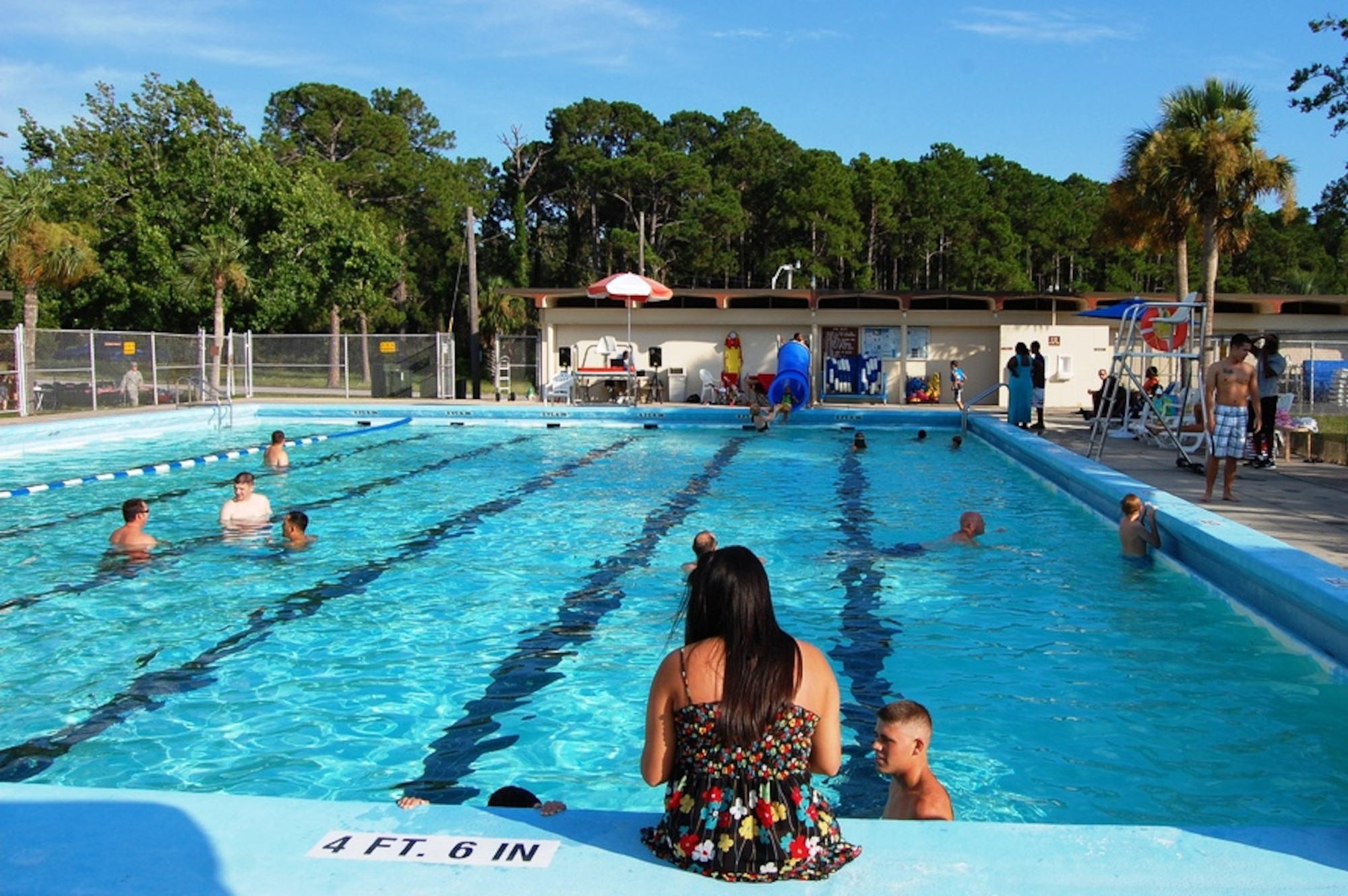 Members of Team Tyndall enjoy the base pool in the summer of 2012 during a Hearts Apart Pool Party. (U.S. Air Force courtesy photo)