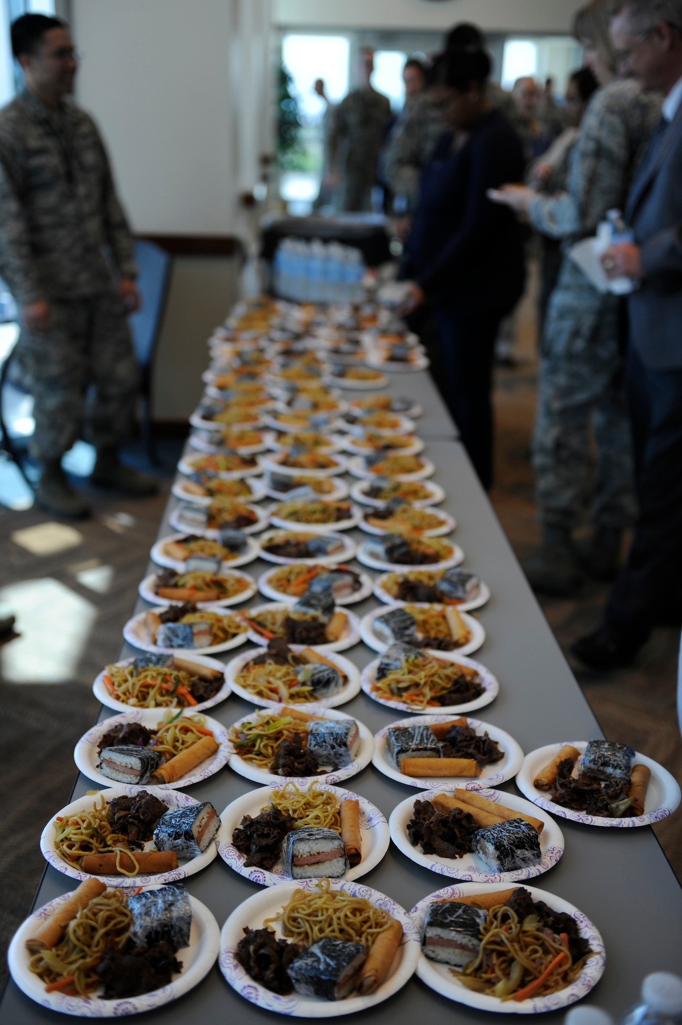 Traditional pacific island and Asian food samples are provided to attendees after Buckley’s Asian-American Pacific Islander Heritage Month Celebration May 14, 2014, at the leadership development center on Buckley Air Force Base, Colo. The ceremony also included a guest speaker and dances performed by the Polynesian dance troupe, Halau Kalama. (U.S. Air Force photo by Airman 1st Class Samantha Saulsbury/Released)