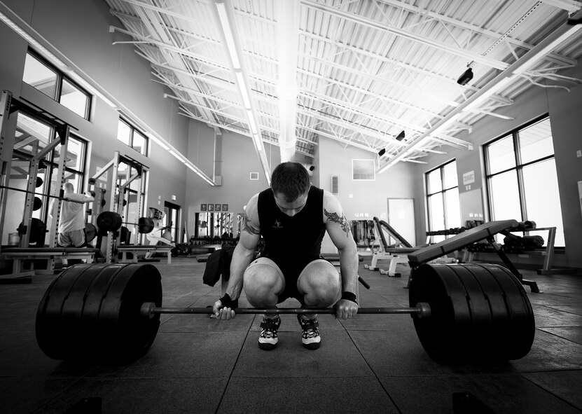 Staff Sgt. Jeffrey Zastrow, of the 96th Medical Group, prepares to deadlift more than 400 pounds as part of his training regime for the Air Force wrestling team May 16 at Eglin Air Force Base, Fla.  The 33-year-old bioenvironmental engineer recently won the 98 kg division of the U.S. Veteran's National Championship held in Las Vegas.  (U. S. Air Force photo/Samuel King Jr.)