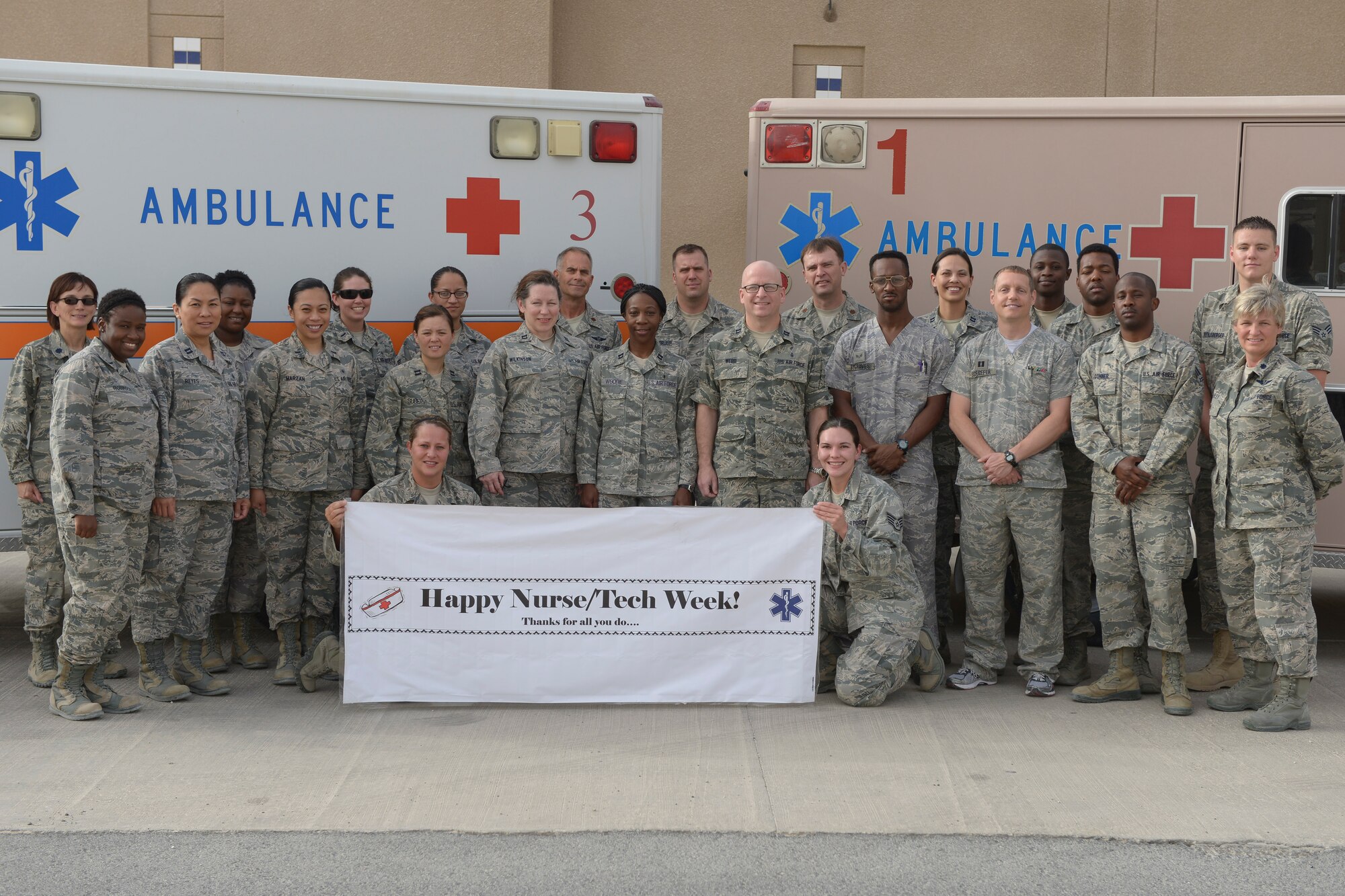 Nurses and Technicians from the 379th Expeditionary Medical Group, pose for a group photo during nurse week May 12, at Al Udeid Air Base, Qatar. National Nurse Week is celebrated annually from May sixth and goes through May 12, the birthday of Florence Nightingale, the founder of modern nursing. At Al Udeid Air Base the 379th Expeditionary Medical Group included technicians as well as part of nurse week. The American Nurses Association Board of Directors expanded "Nurses Day" to a full week; it was officially recognized by the U.S. government in 1993. (U.S. Air Force photo/Senior Airman Colin Cates)