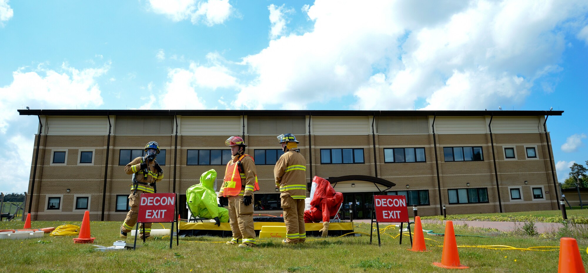 Firefighters from the 48th Civil Engineer Squadron prepare a decontamination station during a hazardous-material exercise at the 493rd Fighter Squadron, Royal Air Force Lakenheath, England, May 13, 2013. Emergency management and bioenvironmental experts entered the facility to examine a suspicious package as part of the 48th Fighter Wing’s weeklong Unit Effectiveness Inspection. (U.S. Air Force photo by Staff Sgt. Thomas Trower/Released)