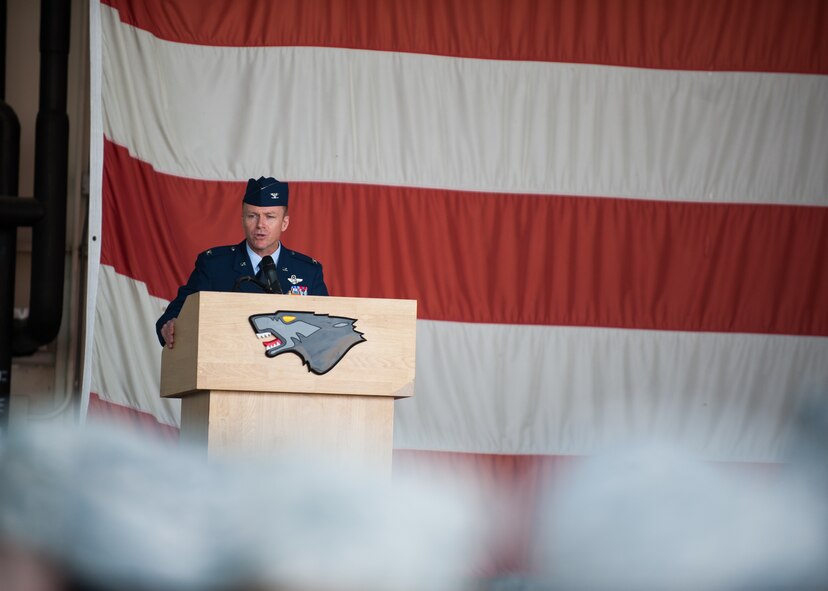 Col. Kenneth Ekman, 8th Fighter Wing commander, speaks during the 8th FW change of command ceremony at Kunsan Air Base, Republic of Korea, May 16, 2014. Col. S. Clinton Hinote relinquished command to Ekman. (U.S. Air Force photo by Staff Sgt. Clayton Lenhardt/Released)