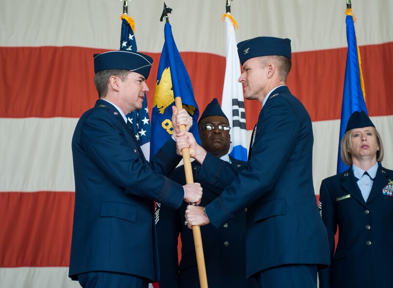 Lt. Gen Jan-Marc Jouas, Republic of Korea and U. S. Combined Forces Command, Air Component Command commander, transfers command to the 8th Fighter Wing commander Col. Kenneth Ekman during the 8th FW change of command ceremony at Kunsan Air Base, Republic of Korea, May 16, 2014. Col. S. Clinton Hinote relinquished command to Ekman. (U.S. Air Force photo by Staff Sgt. Clayton Lenhardt/Released)