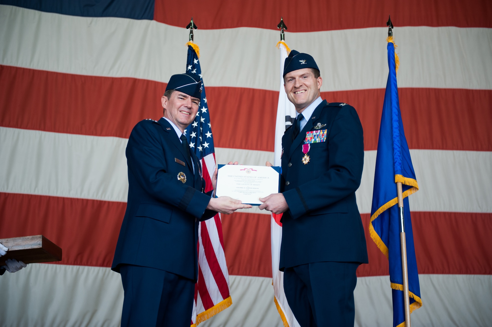 Col. S. Clinton Hinote, outgoing commander, receives the Legion of Merit from Lt. Gen. Jan-Marc Jouas, Republic of Korea and U. S. Combined Forces Command, Air Component Command commander, during the 8th Fighter Wing change of command ceremony at Kunsan Air Base, Republic of Korea, May 16, 2014. Hinote relinquished command to Col. Kenneth Ekman. (U.S. Air Force photo by Staff Sgt. Clayton Lenhardt/Released)
