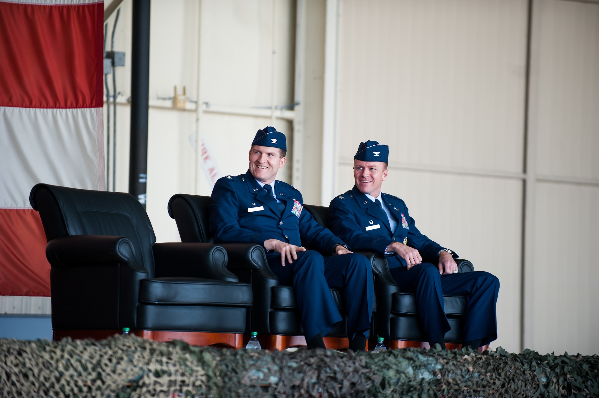 Col. S. Clinton Hinote, outgoing commander, and Col. Kenneth Ekman, 8th Fighter Wing commander, share a laugh during the change of command ceremony at Kunsan Air Base, Republic of Korea, May 16, 2014. During the ceremony command was transferred from Wolf 53 to Wolf 54. (U.S. Air Force photo by Staff Sgt. Clayton Lenhardt/Released)