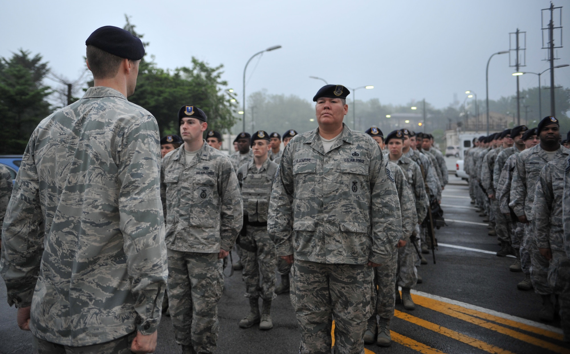 Capt. Joseph Schneider, 51st Security Forces Squadron operations officer, calls a formation to attention for the Police Week reveille ceremony at Osan Air Base, Republic of Korea, May 12, 2014. Police Week is an annual celebration of both military and civilian police officers’ service, as well as a time to commemorate the sacrifices of their fallen comrades. (U.S. Air Force photo/Airman 1st Class Ashley J. Thum) 