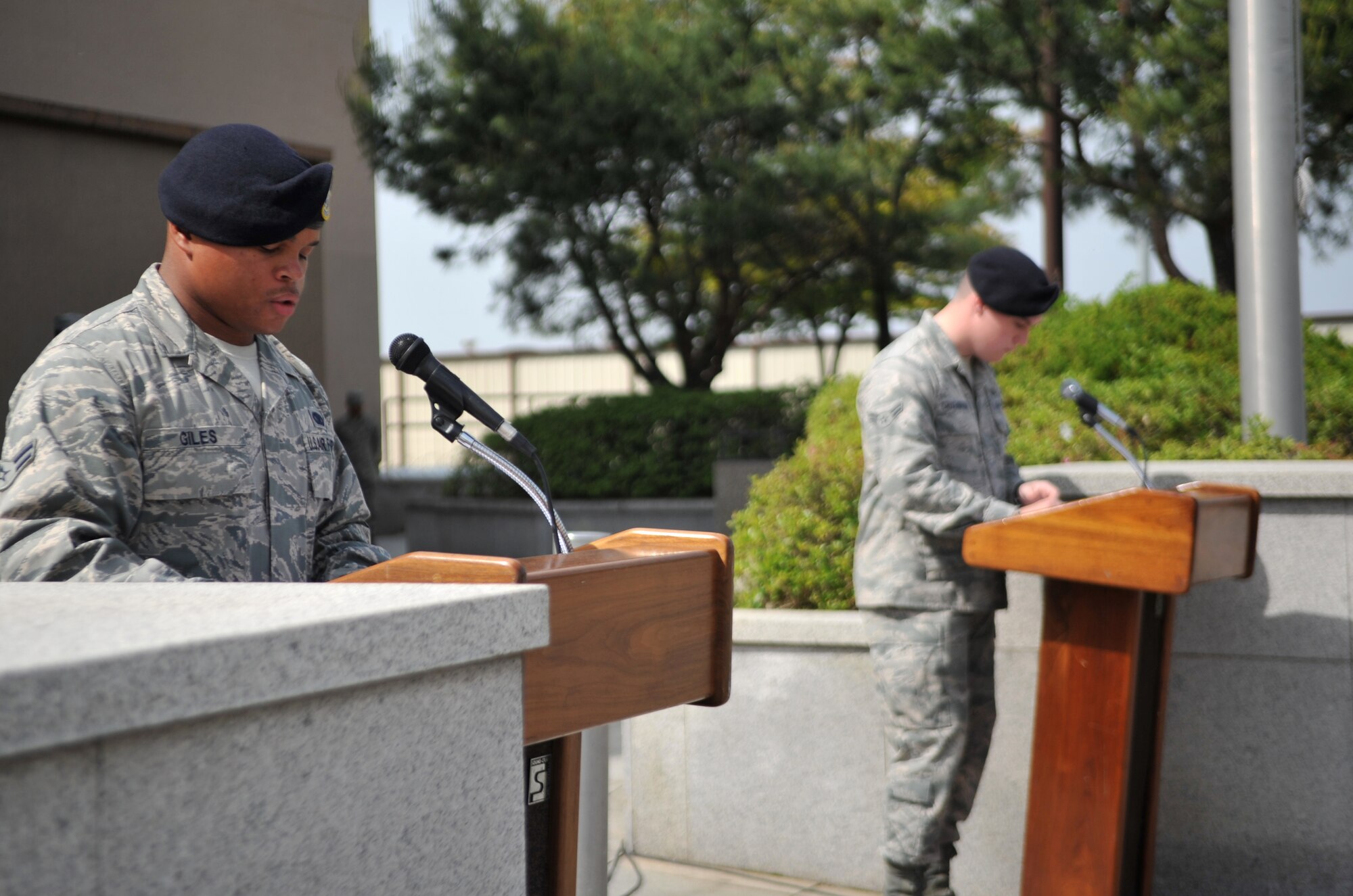 Airmen from the 51st Security Forces Squadron read the names of fallen law enforcement officers during the Police Week retreat ceremony at Osan Air Base, Republic of Korea, May 16, 2014. The names of fallen ROK military law enforcement officers and Korean National Police officers were also included. (U.S. Air Force photo/Airman 1st Class Ashley J. Thum)
