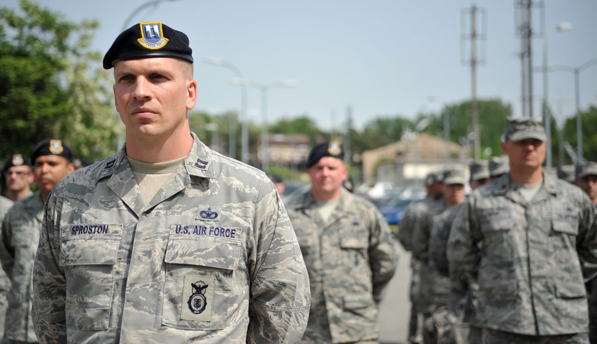 Capt. Devin Sproston, 51st Security Forces Squadron, heads up the formation for the Police Week retreat ceremony at Osan Air Base, Republic of Korea, May 16, 2014. Defenders and agents from the Office of Special Investigations 5th Field Investigations Squadron manned the formation together. (U.S. Air Force photo/Airman 1st Class Ashley J. Thum)