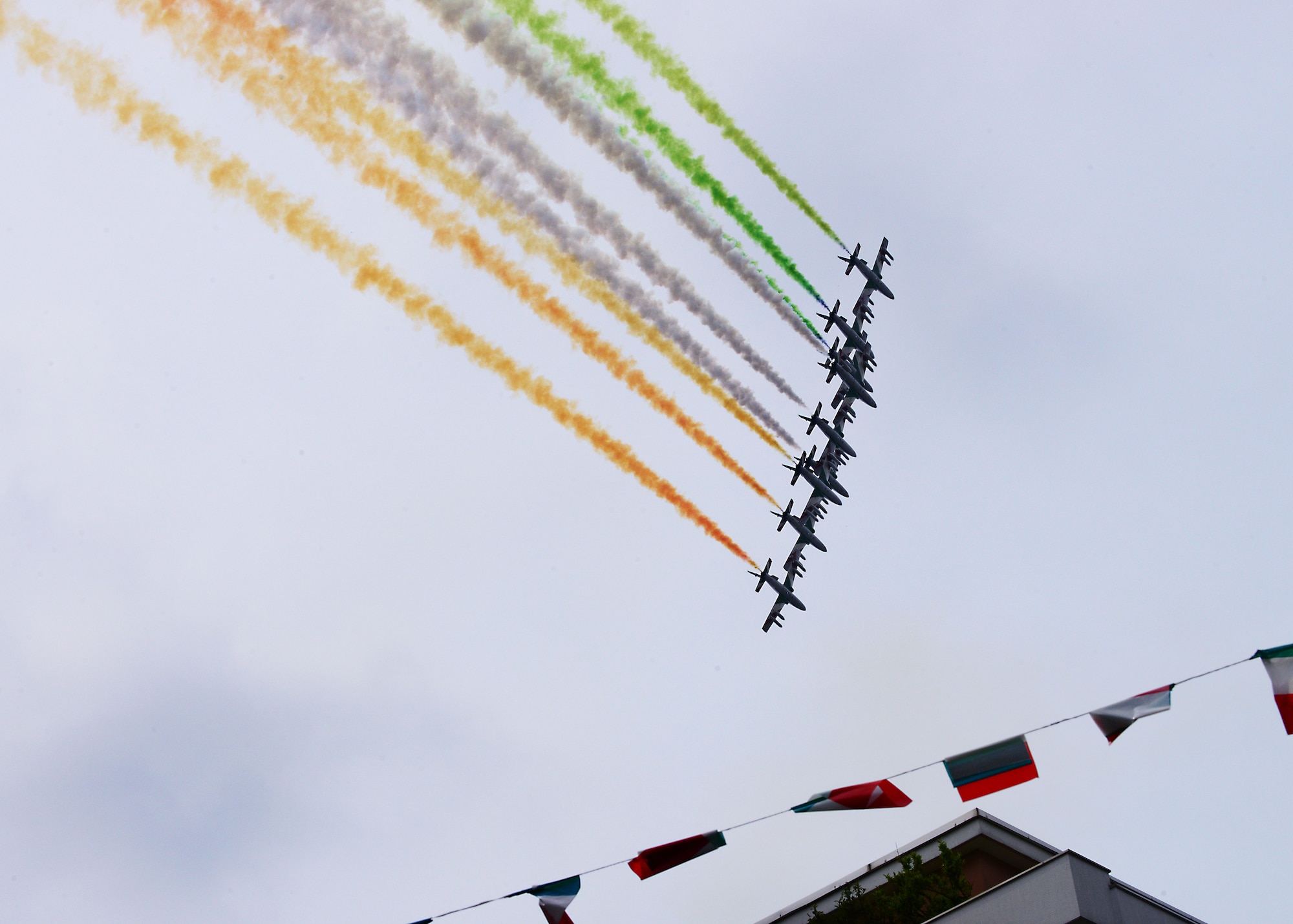 Italian aerial acrobatics team, Frecce Tricolore, perform a flyover of the 2014 Alpini parade, May 11, 2014, in downtown Pordenone, Italy. The Alpini was formed as a special mountain infantry formation in 1872 and was made of mountain men who were hardened by the rigors of the Alpine life. (U.S. Air Force photo/Airman 1st Class Ryan Conroy) 