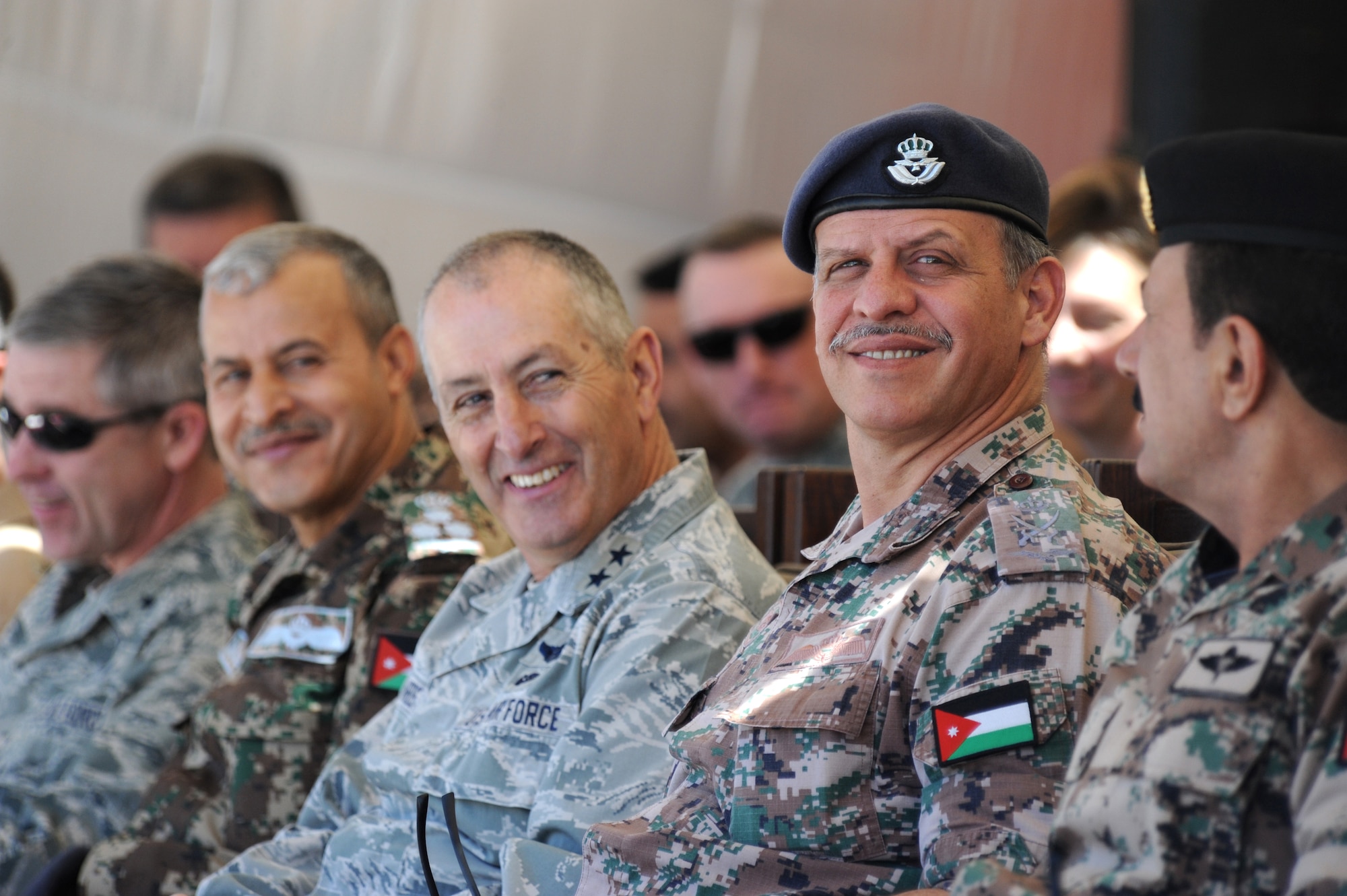 His Royal Highness Prince Faisal bin al-Hussein of Jordan, right, watches a first-run attack competition with U.S. Air Force Maj. Gen. Mike Edwards, adjutant general of the Colorado Air National Guard, center, during Exercise Eager Tiger May 14, 2014, at an air base in northern Jordan. This year marks the 10th year the COANG and Jordan have been paired under the National Guard Bureau's State Partnership Program. (U.S. Air Force photo by Staff Sgt. Brigitte N. Brantley/Released)