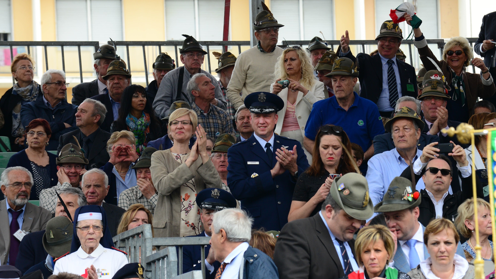 (Center) Brig. Gen. Jon A. Norman, 31st Fighter Wing commander, applauds the passing Alpini parade from the viewing stand, May 11, 2014, in downtown Pordenone, Italy. Various leading Italian officials and military members were all among those watching from the viewing stand to commemorate the 87th gathering of the mountain soldiers of Italy. (U.S. Air Force photo/Airman 1st Class Ryan Conroy) 