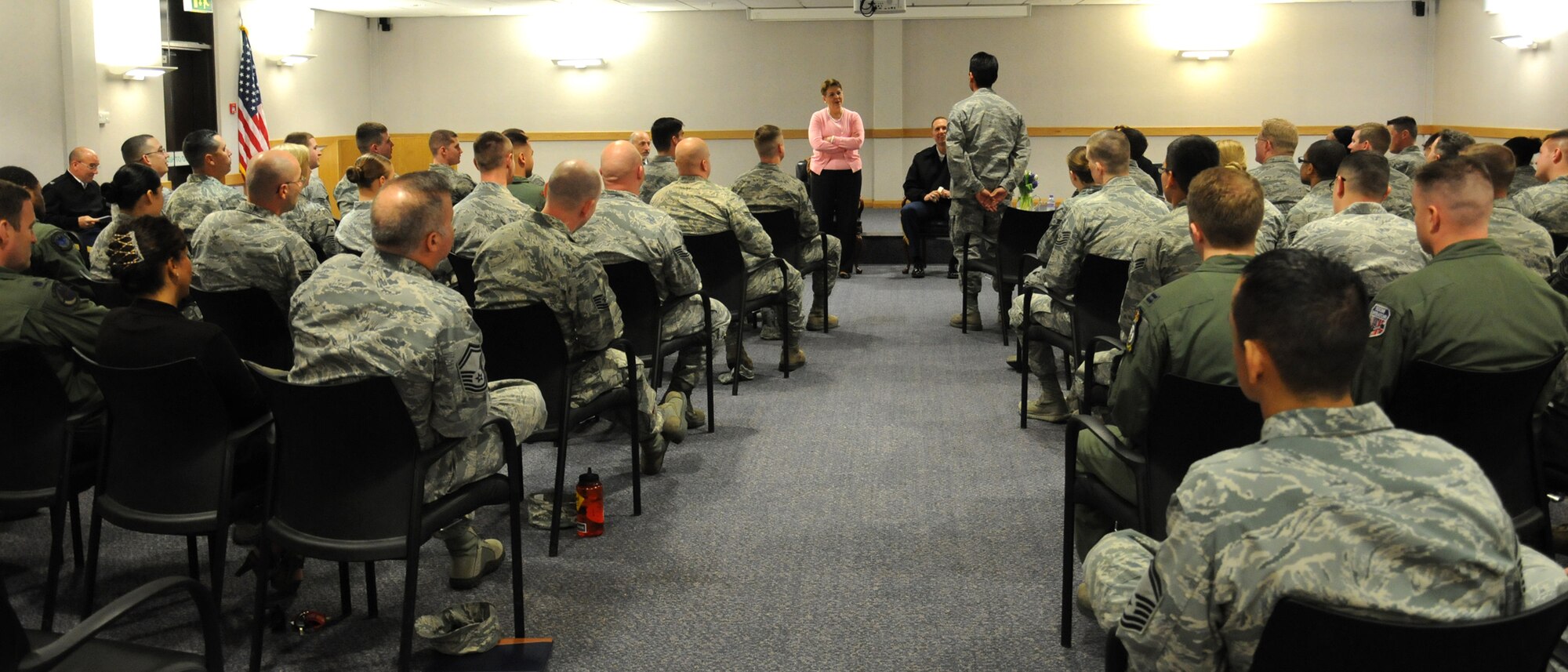 The Honorable Jessica Wright, acting undersecretary of defense for personnel and readiness, speaks to Team Mildenhall members during a town hall meeting May 14, 2014, on RAF Mildenhall, England. Wright toured the base with Team Mildenhall leadership and met Airmen who told her about their careers. She was the first female maneuver brigade commander in the Pennsylvania Army National Guard. (U.S. Air Force photo by Gina Randall/Released)